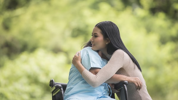 Mother and daughter hugging