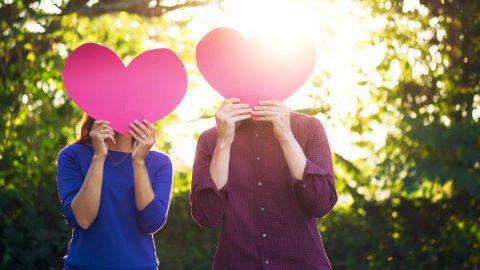 couple holding hearts