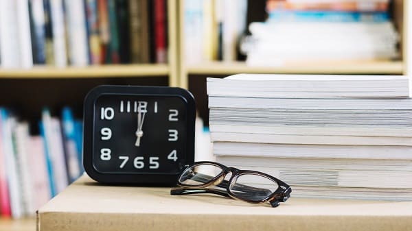 clock and books