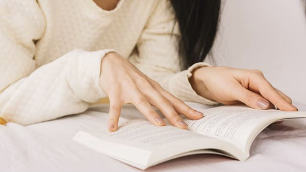 woman is reading book