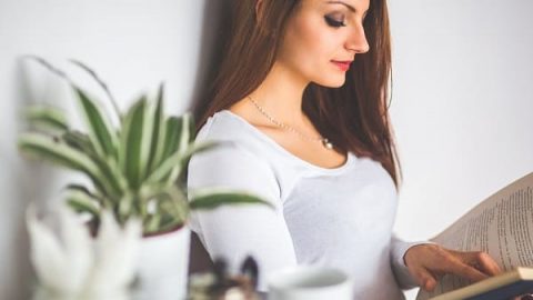 A woman is reading a book