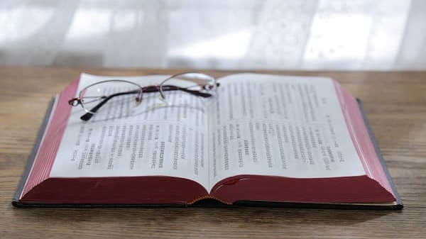 A pair of glasses and the bible