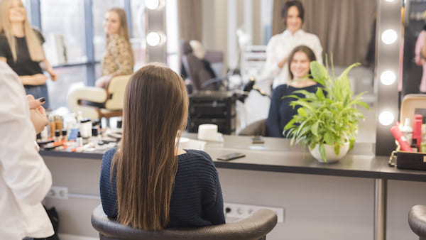 Woman and her friend into the salon