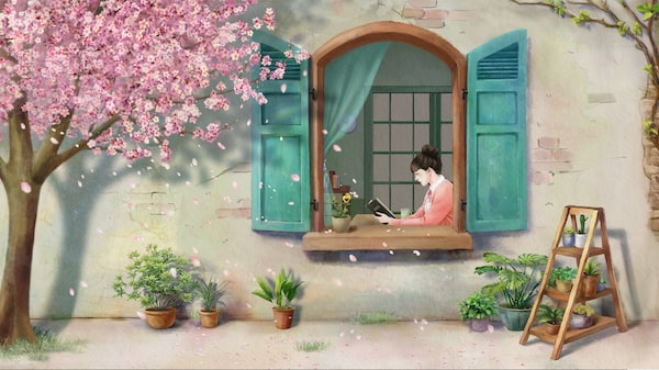 A girl is reading at the window