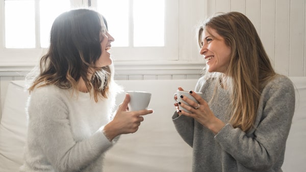 Women having a pleasant conversation on the couch
