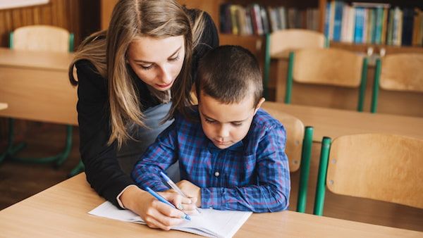 Mom teaches son to write