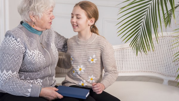 Grandmother and granddaughter having a happy conversation